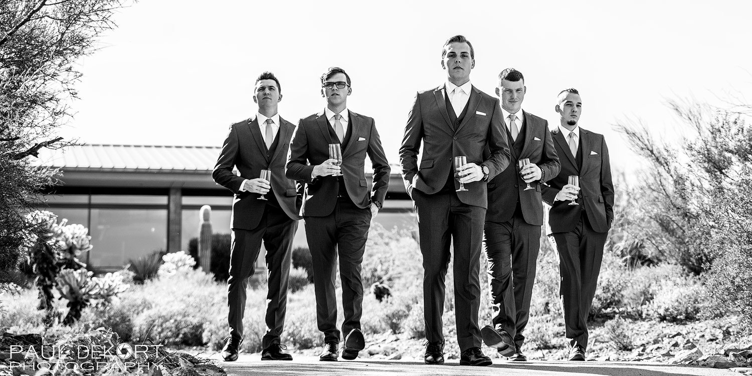 Black and white photo of Groomsmen walking before the wedding at Ironwood CC in Anthem, Arizona
